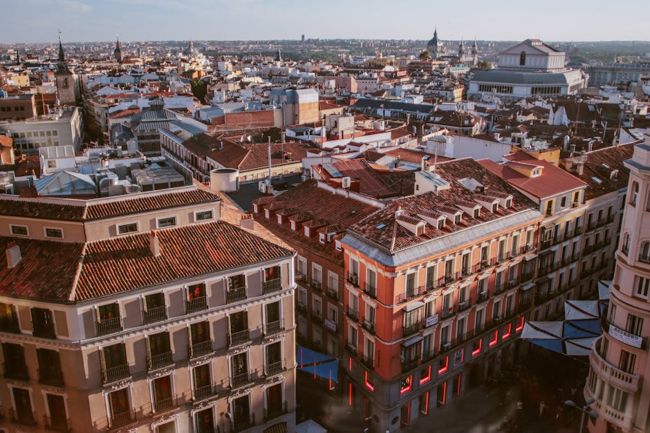 Beautiful aerial view of Madrid's urban landscape with iconic rooftops and architecture.